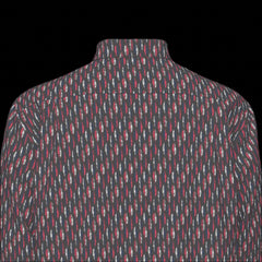 Top back of patterned long sleeve shirt on a black background