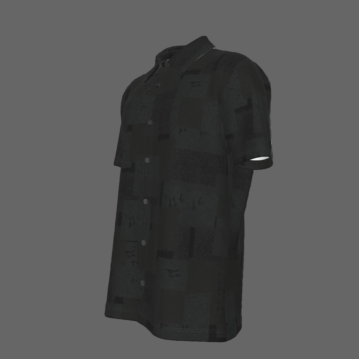 Left side of a black textured short-sleeve button-down shirt on a black background