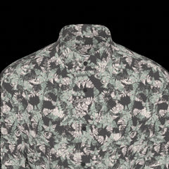 Top front of floral patterned long sleeve shirt on a black background