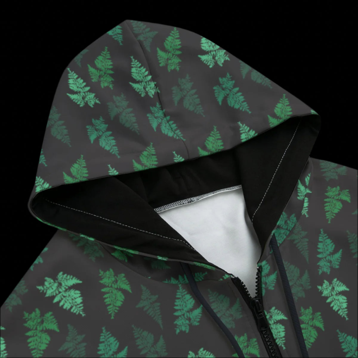 Front top of Hoodie with green leaf pattern on a black background