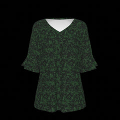 Front of green patterned blouse on a black background