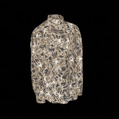 Right side of a camouflage-patterned long sleeve shirt on a black background