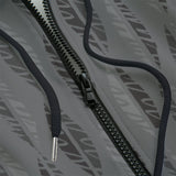 Close-up of a grey hoodie with a black zipper