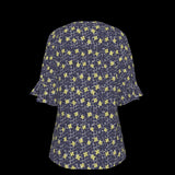 Back of navy blue blouse with yellow floral pattern on a black background