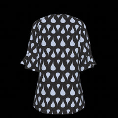 Back of green leaf patterned blouse on a black background