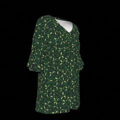 Right side of green patterned blouse on a black background