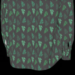 Bottom back of green and black patterned long sleeve shirt on a black background