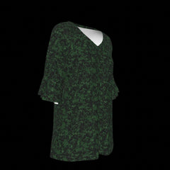 Right side of green patterned blouse on a black background
