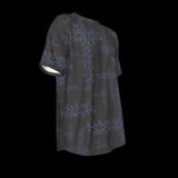 Right side of black t-shirt with blue floral patterns on a black background