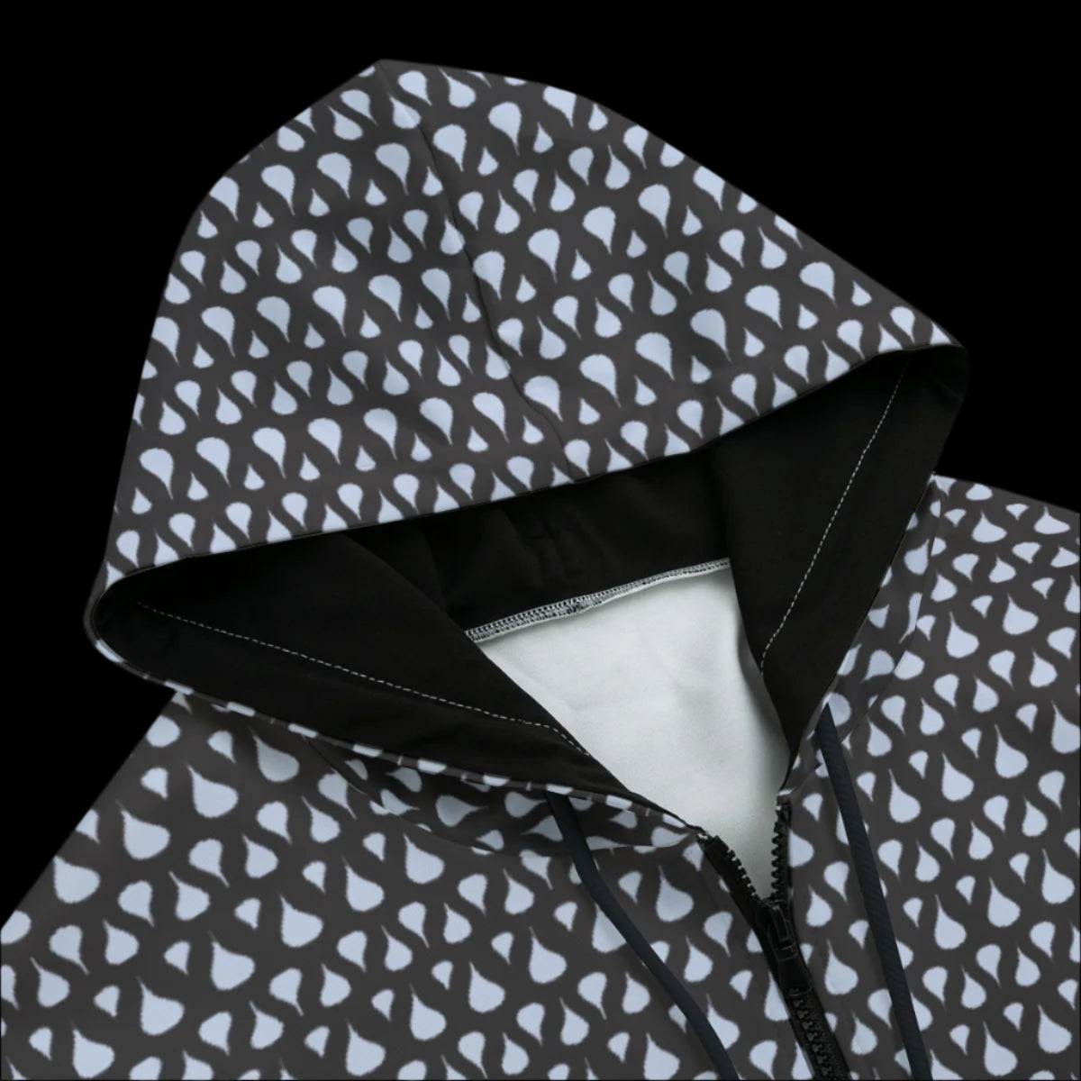 Front top of Black zipper hoodie with a gray and blue design on a black background