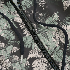 Front detail of hoodie with floral pattern on a black background
