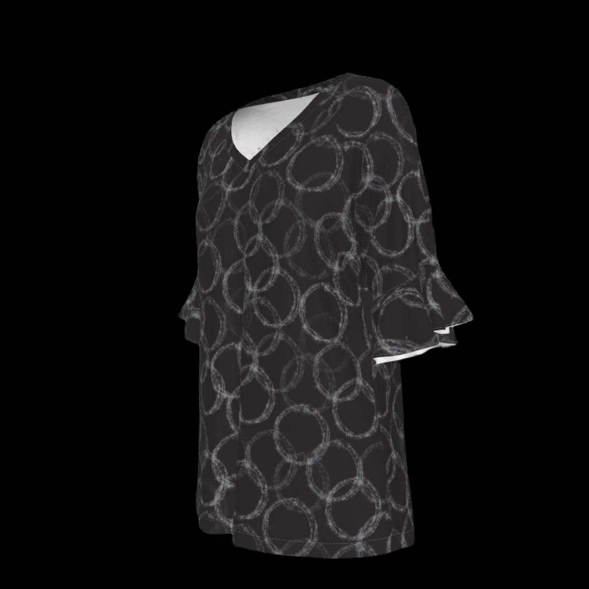 Left side of black and white patterned blouse on a black background